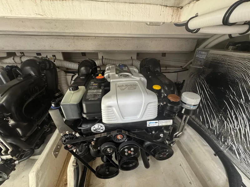 Slide: The Image of Engine compartment of 2020 Cruisers Yachts 39 Express Coupe, showcasing detailed mechanical components. - 48