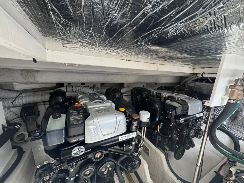 Slide: The Image of Engine compartment of 2020 Cruisers Yachts 39 Express Coupe, showcasing dual engines. - 49