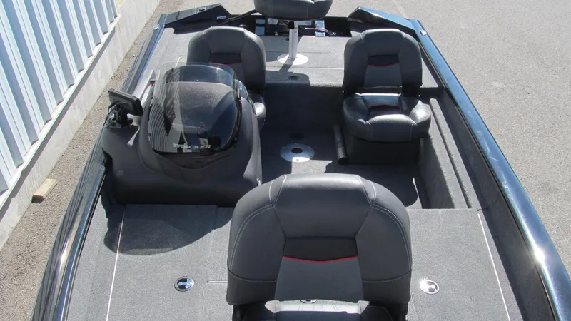 Slide: The Image of 2024 Tracker Pro Team 175 TF boat interior with seating and steering console. - 11