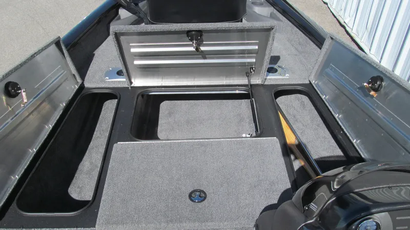 Slide: The Image of 2024 Tracker Pro Team 175 TF boat storage compartments open, showcasing ample space. - 9