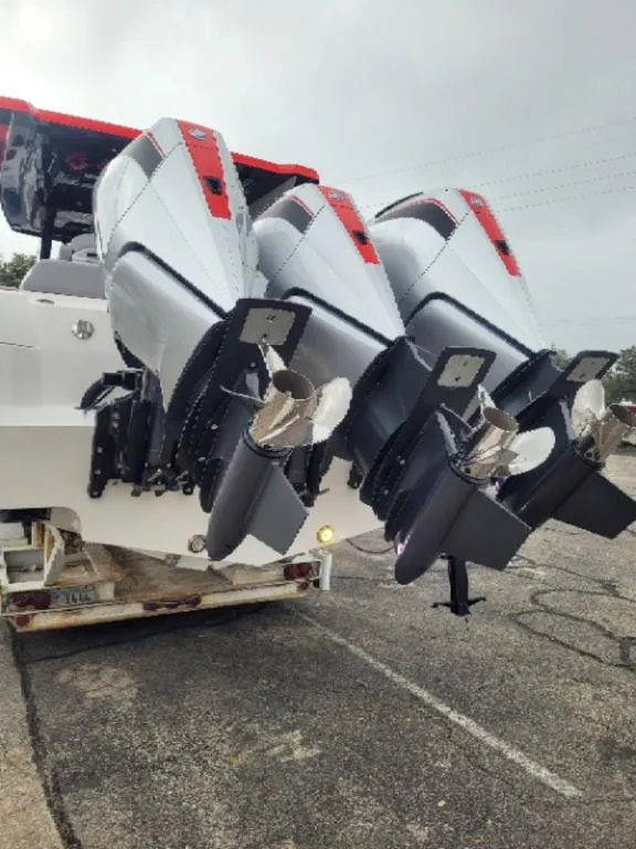 Slide: The Image of 2024 Fountain 38 SCX boat with triple outboard engines, rear view. - 16