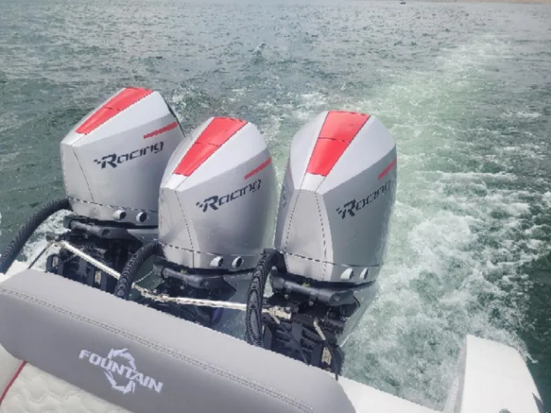 Slide: The Image of 2024 Fountain 38 SCX boat with triple Racing outboard engines on water. - 22