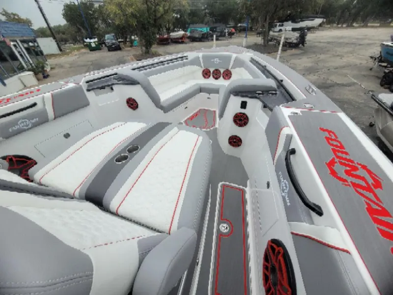 Slide: The Image of 2024 Fountain 38 SCX boat interior with stylish seating and red accents. - 3