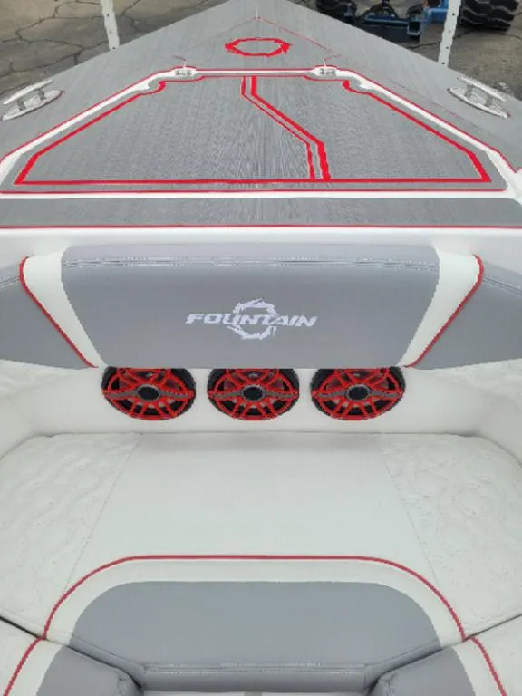 Slide: The Image of 2024 Fountain 38 SCX boat interior with red accents and audio system. - 7