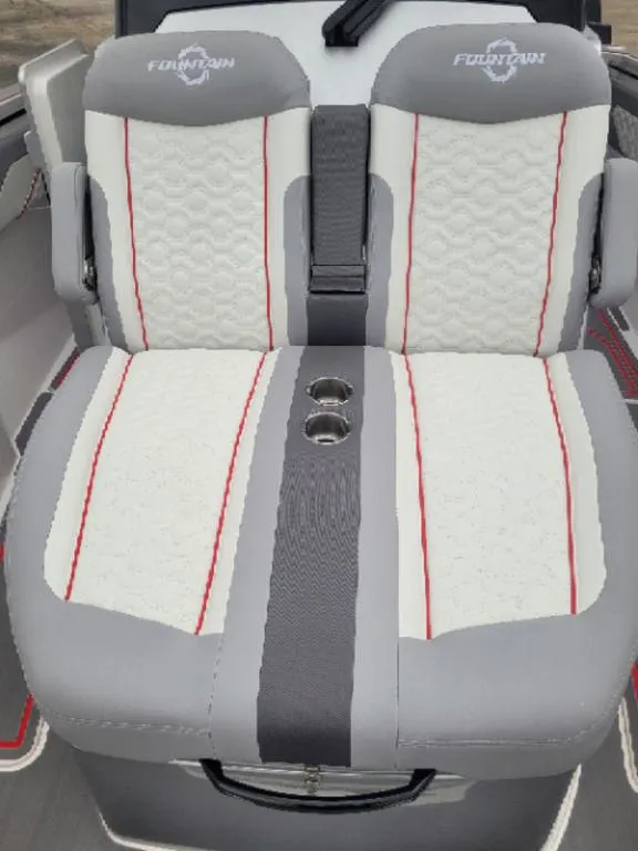 Slide: The Image of 2024 Fountain 38 SCX boat seats with gray, white, and red accents, featuring cup holders. - 8