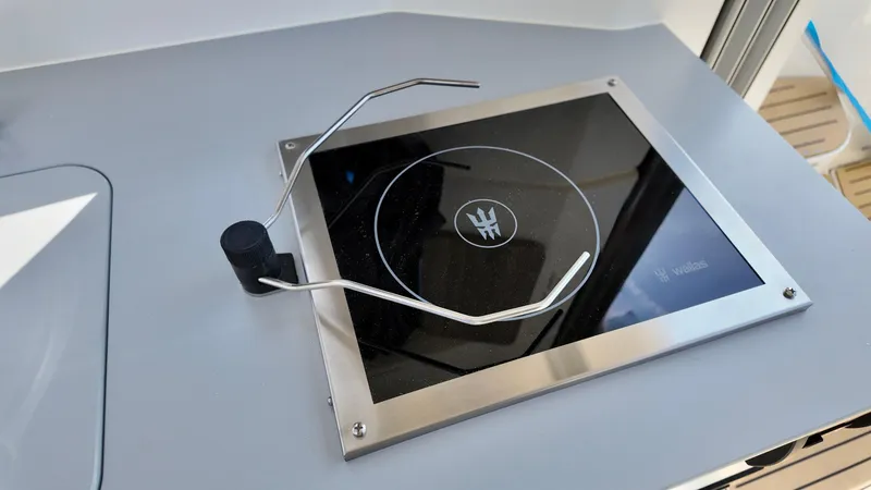 Slide: The Image of Stovetop on 2025 Bayliner TROPHY 25 EXPLORER boat, featuring sleek design and modern controls. - 19