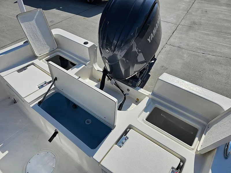 Slide: The Image of 2025 Bulls Bay 2200 XS boat with Yamaha engine and open storage compartments. - 11