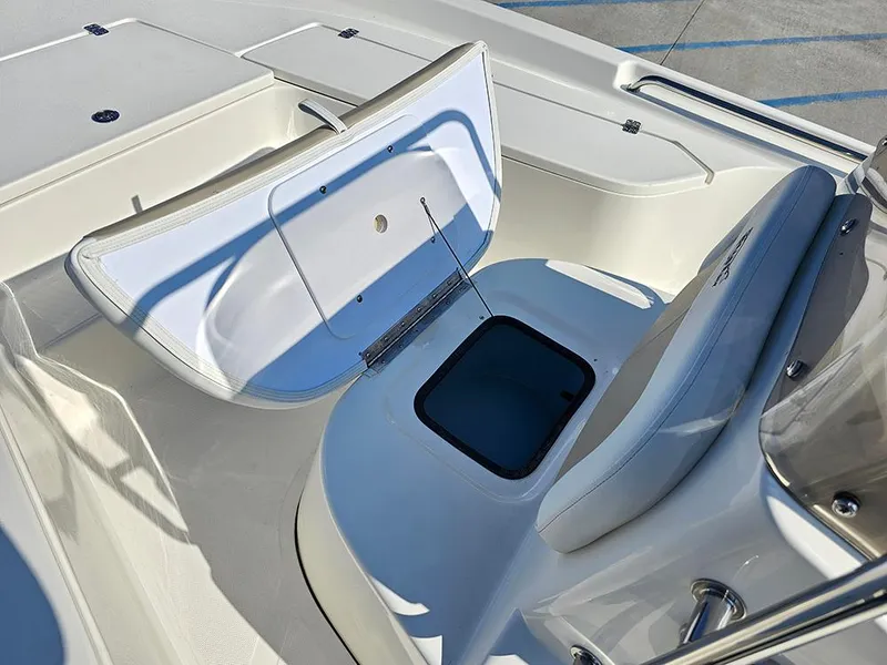 Slide: The Image of 2025 Bulls Bay 2200 XS boat interior with open storage compartment and seating. - 15