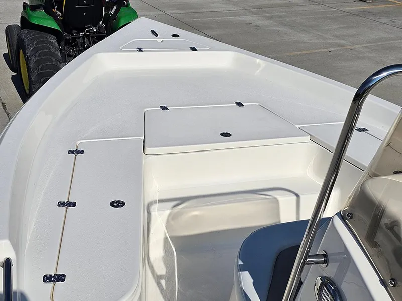 Slide: The Image of 2025 Bulls Bay 2200 XS boat deck with storage compartments and railing. - 16