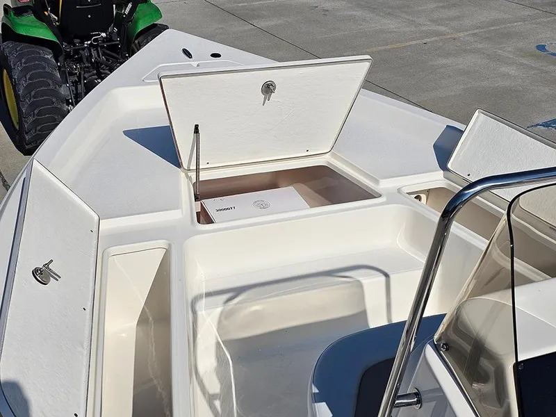 Slide: The Image of 2025 Bulls Bay 2200 XS boat deck with open storage compartments. - 17