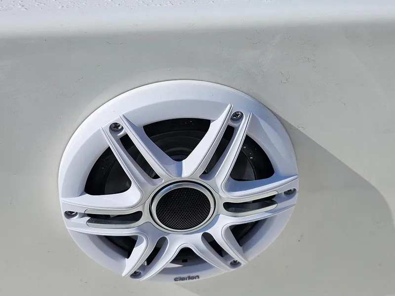 Slide: The Image of Speaker on 2025 Bulls Bay 2200 XS boat, featuring sleek white design. - 19