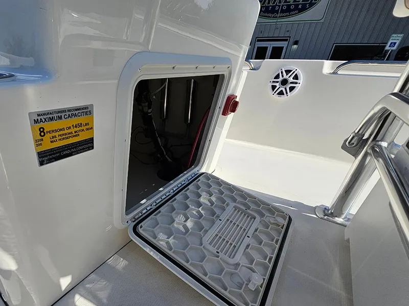 Slide: The Image of 2025 Bulls Bay 2200 XS boat storage compartment with capacity label and open hatch. - 21