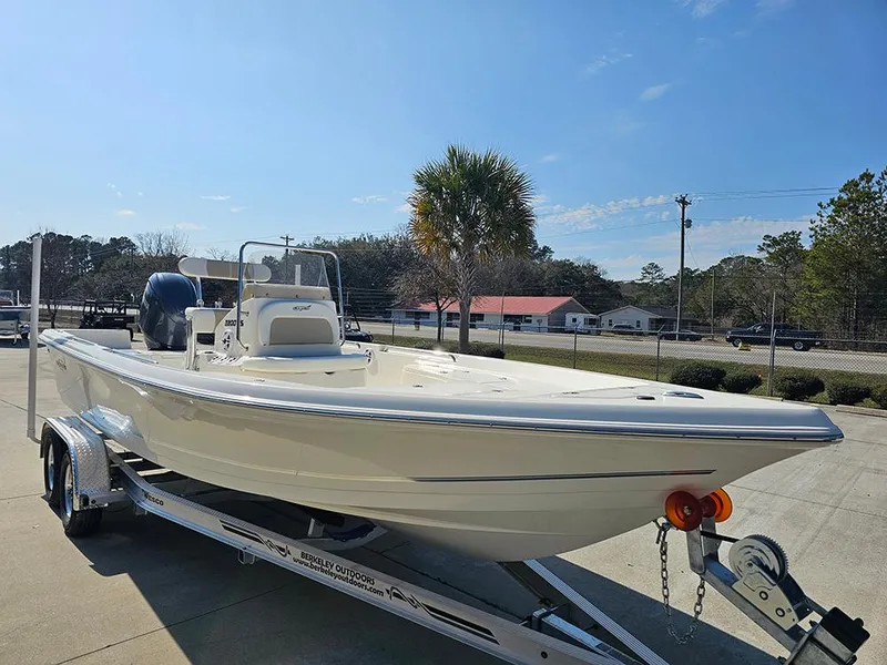 Slide: The Image of 2025 Bulls Bay 2200 XS boat on trailer under clear blue sky. - 5