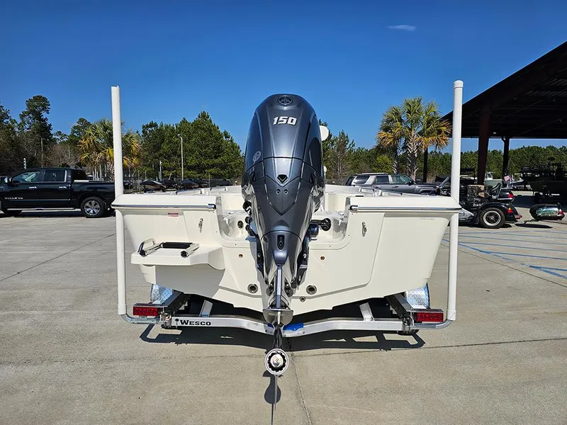 Slide: The Image of 2025 Bulls Bay 2200 XS boat with 150 HP engine on trailer, outdoor setting. - 8