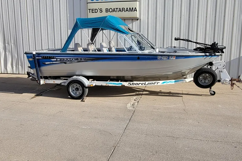 The Image of 1995 Crestliner Sportfish 1750 boat on ShoreLand'r trailer, parked outside Ted's Boatarama. - 1