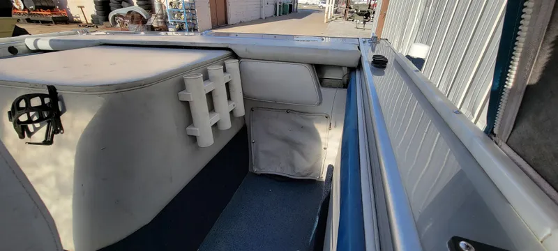 Slide: The Image of 1995 Crestliner Sportfish 1750 interior, featuring seating and storage compartments. - 16