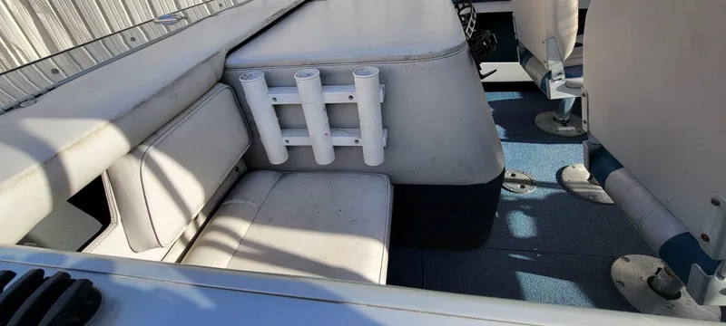 Slide: The Image of 1995 Crestliner Sportfish 1750 boat interior with seating and rod holders. - 17