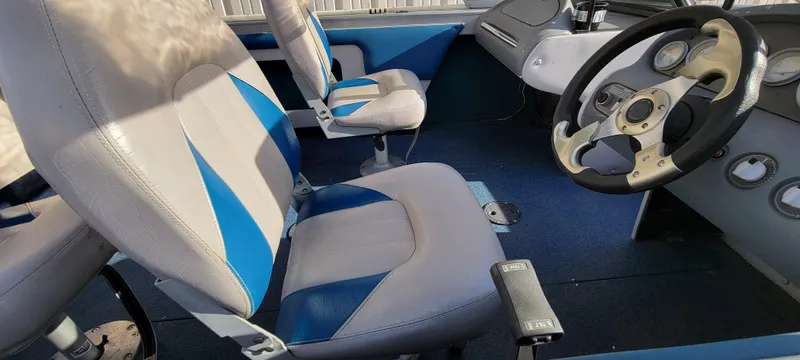 Slide: The Image of Interior of 1995 Crestliner Sportfish 1750 boat with blue and gray seating. - 19