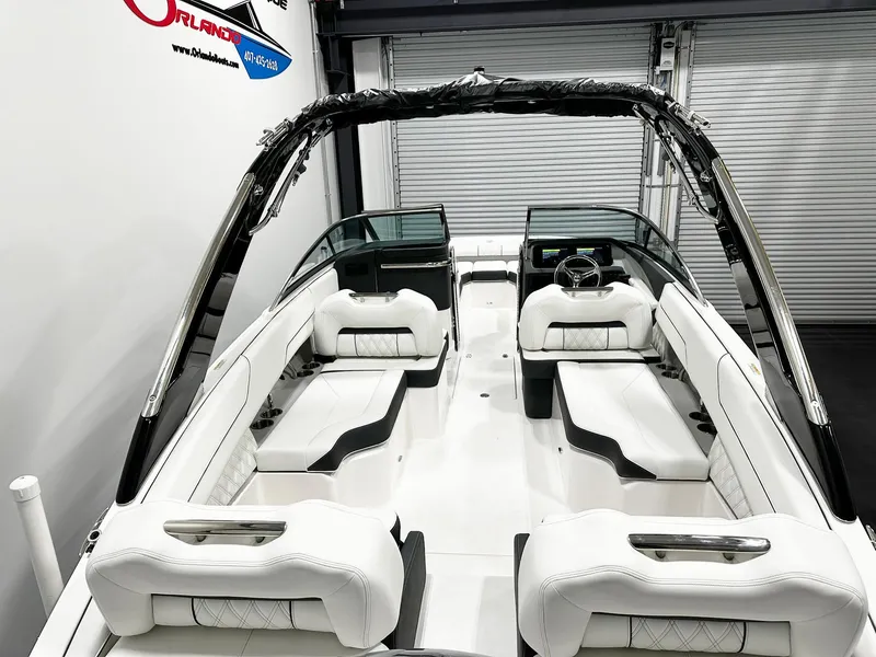 Slide: The Image of 2025 Regal LX4 boat interior with white seating and sleek design. - 4