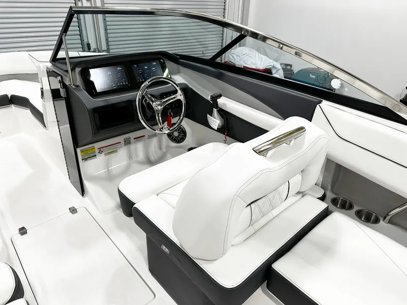 Slide: The Image of 2025 Regal LX4 boat interior with sleek white seating and modern dashboard. - 5