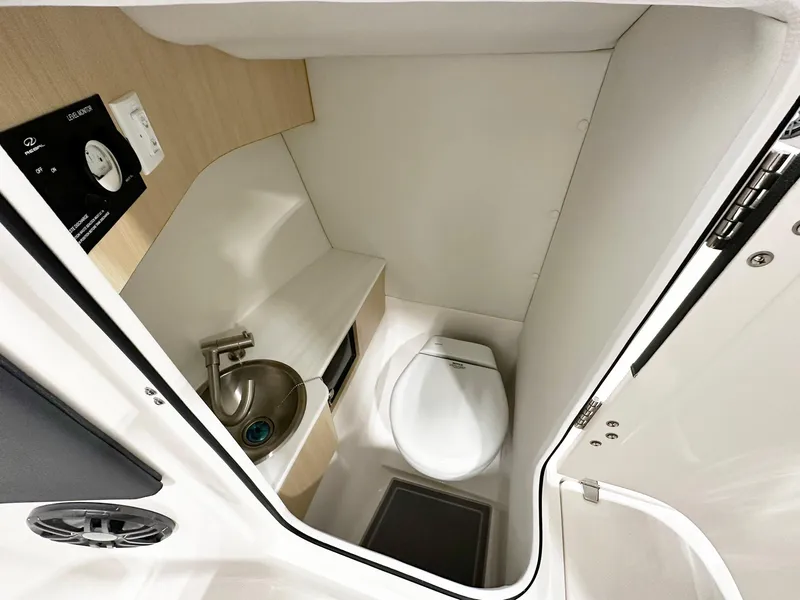 Slide: The Image of Compact bathroom in 2025 Regal LX4 boat with modern sink and toilet. - 8