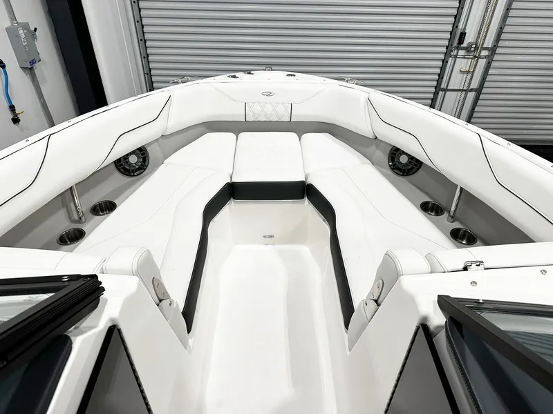 Slide: The Image of 2025 Regal LX4 boat interior with white seating and modern design. - 9