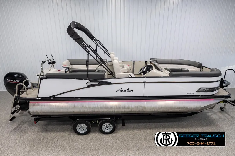 Slide: The Image of 2021 Avalon Catalina QL pontoon boat on trailer in showroom. - 1