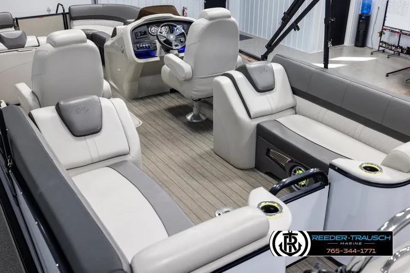 Slide: The Image of 2021 Avalon Catalina QL boat interior with luxurious seating and modern dashboard. - 11