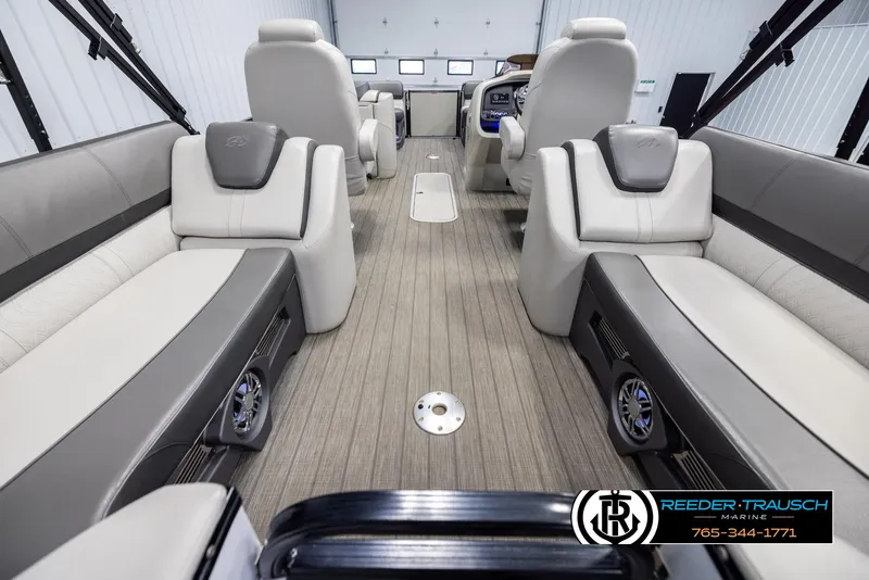 Slide: The Image of 2021 Avalon Catalina QL interior with luxurious seating and modern design in a showroom. - 16