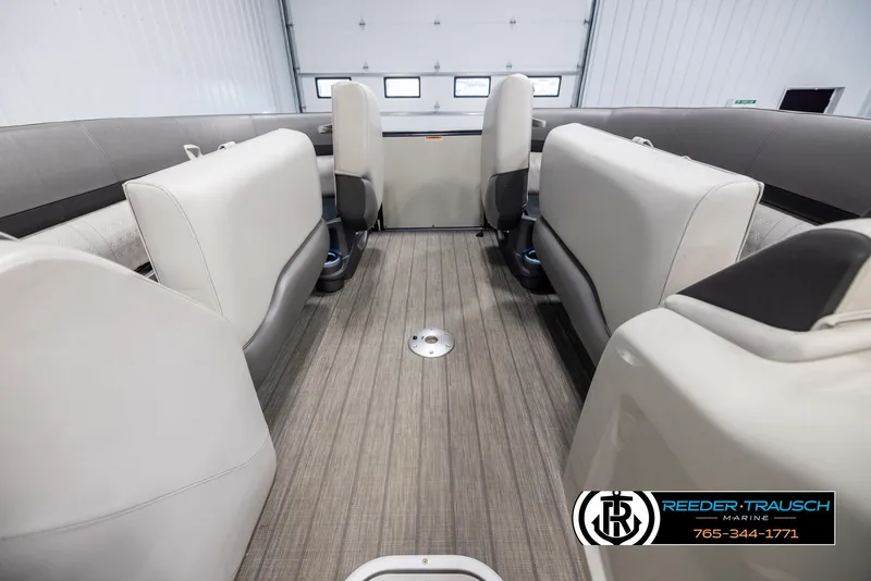 Slide: The Image of Interior of 2021 Avalon Catalina QL pontoon boat with beige seating and wood-style flooring. - 19
