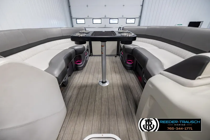 Slide: The Image of 2021 Avalon Catalina QL boat interior with luxurious seating and table setup. - 20