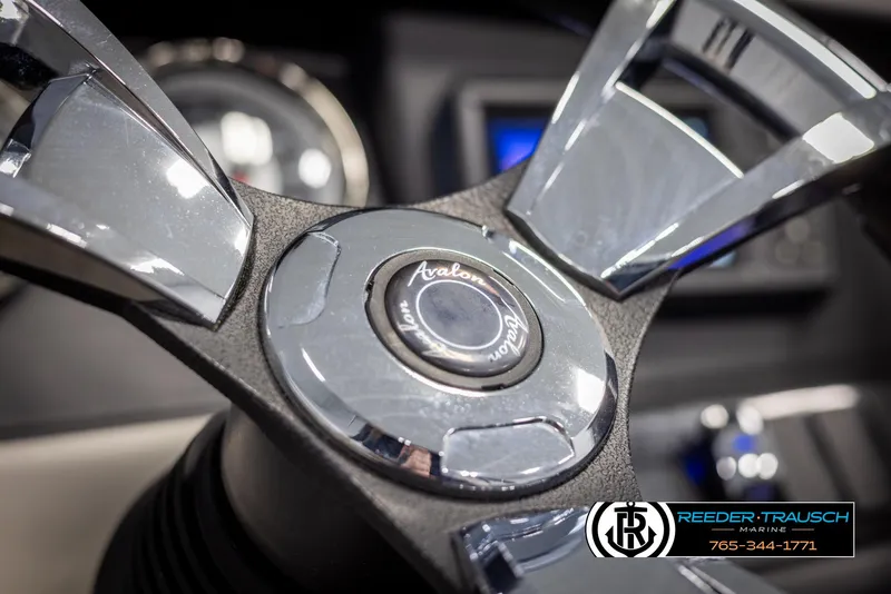 Slide: The Image of Steering wheel of 2021 Avalon Catalina QL boat, featuring sleek chrome design. - 28