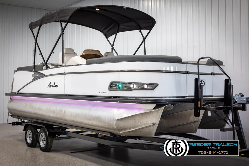 Slide: The Image of 2021 Avalon Catalina QL pontoon boat on trailer in indoor showroom. - 3