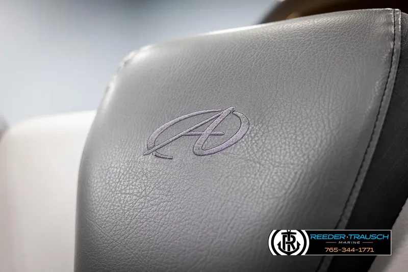 Slide: The Image of 2021 Avalon Catalina QL seat with embroidered logo, featuring Reeder-Trausch Marine branding. - 37