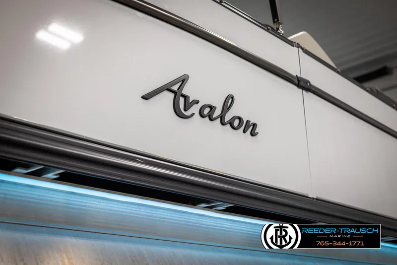 Slide: The Image of 2021 Avalon Catalina QL boat with sleek design and Reeder-Trausch Marine branding. - 49