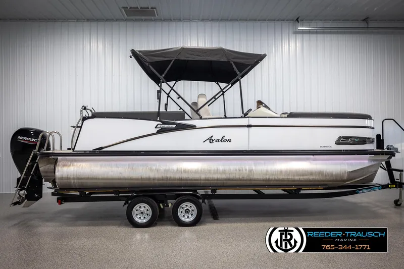 Slide: The Image of 2021 Avalon Catalina QL pontoon boat on trailer in indoor showroom. - 5