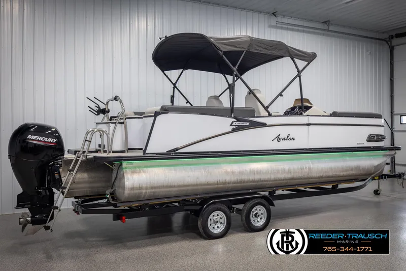 Slide: The Image of 2021 Avalon Catalina QL pontoon boat on trailer in indoor showroom. - 6