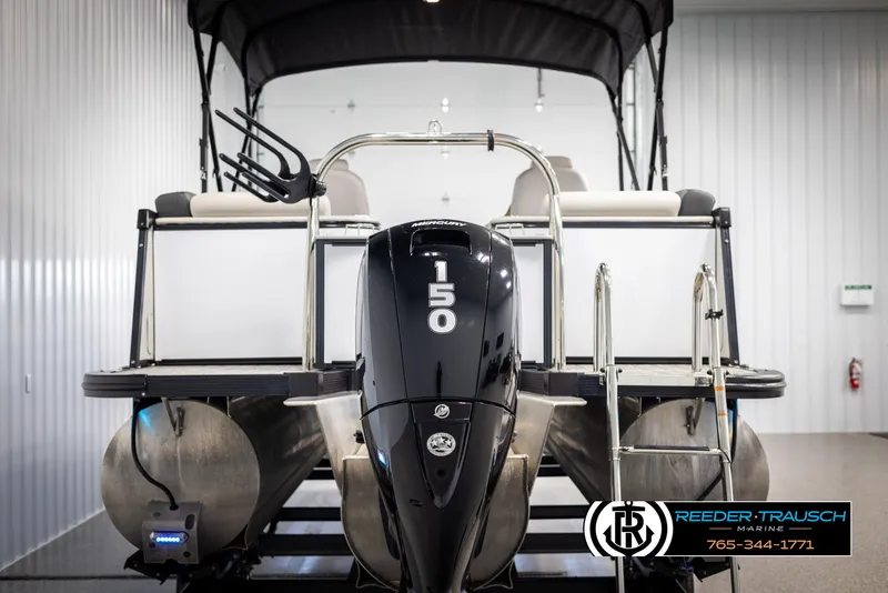 Slide: The Image of 2021 Avalon Catalina QL pontoon boat with 150 HP engine in showroom. - 7