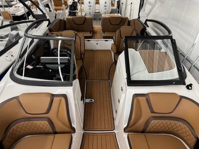 Slide: The Image of 2025 Yamaha Boats 252SD interior with brown seating and sleek design. - 2