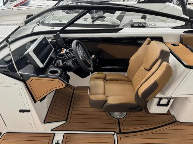 Slide: The Image of 2025 Yamaha Boats 252SD cockpit with tan seating and modern dashboard. - 4