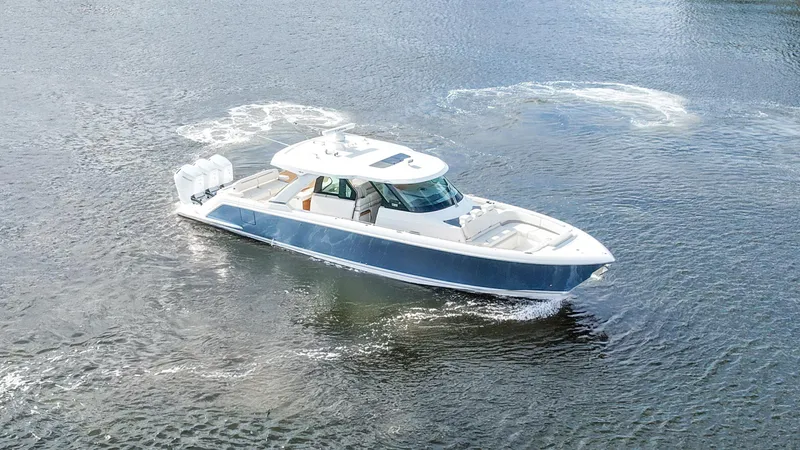 The Image of 2022 Tiara Yachts 48 LS cruising on open water, showcasing sleek design and luxury features. - 0