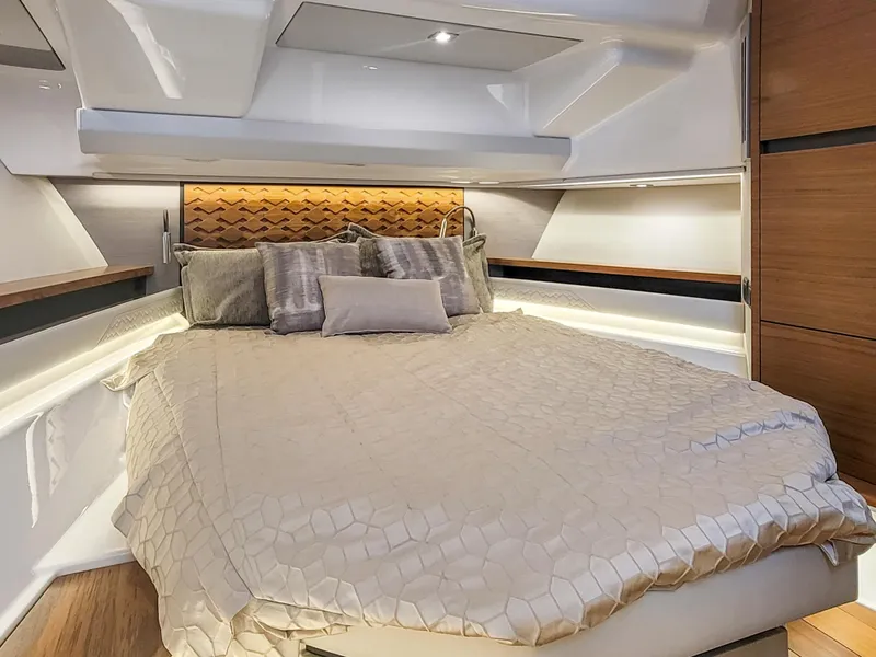 Slide: The Image of Luxurious bedroom interior of 2022 Tiara Yachts 48 LS with modern design and cozy bedding. - 22