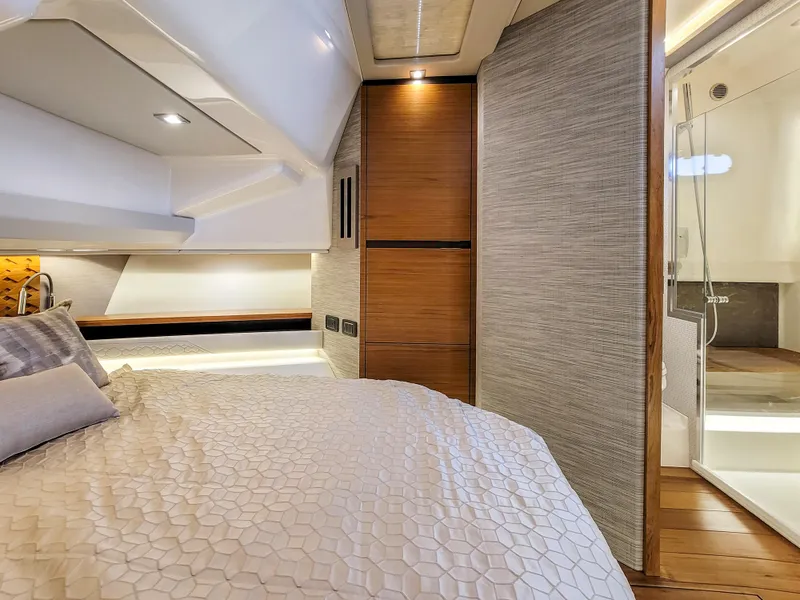 Slide: The Image of Luxurious interior of 2022 Tiara Yachts 48 LS, featuring a cozy bedroom and modern bathroom. - 23