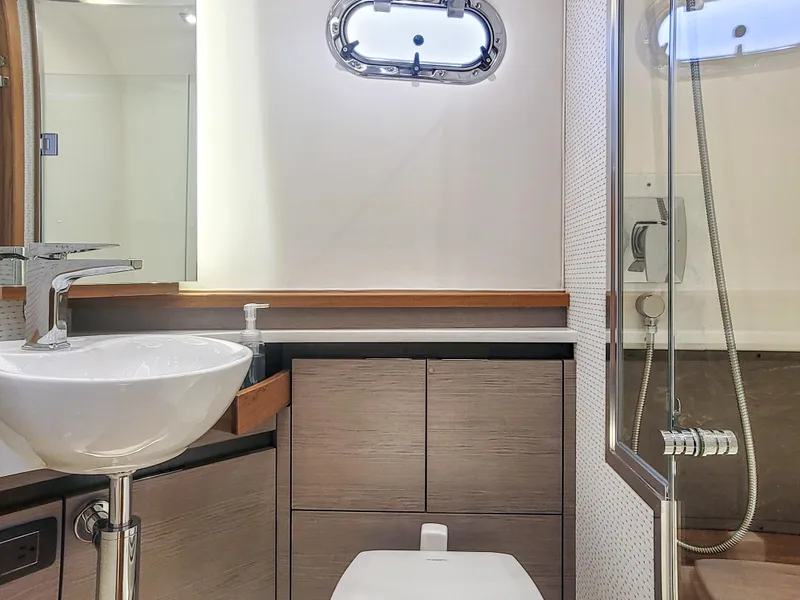 Slide: The Image of Modern bathroom in 2022 Tiara Yachts 48 LS, featuring sleek sink and shower. - 25