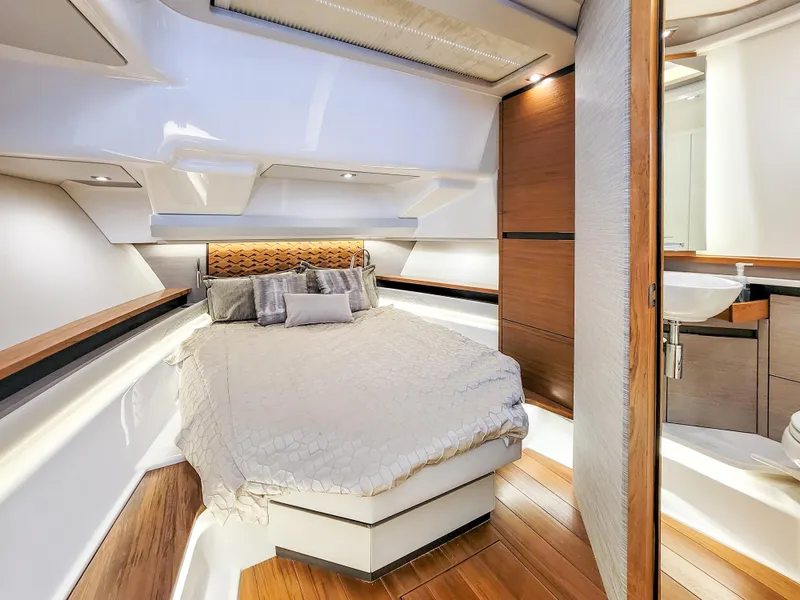 Slide: The Image of Luxurious cabin interior of 2022 Tiara Yachts 48 LS with elegant wood finishes. - 26