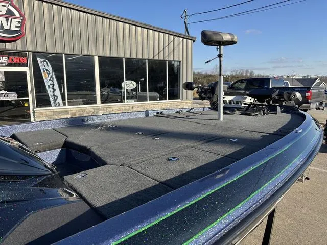 Slide: The Image of 2019 Skeeter ZX250 boat with fishing deck, parked outside a showroom. - 8