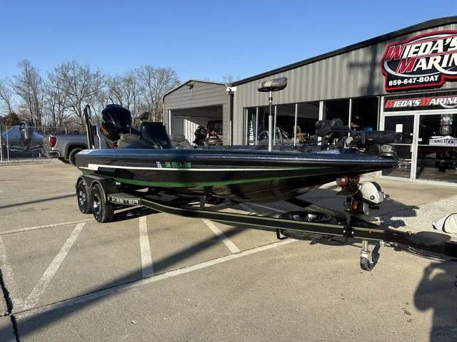 Slide: The Image of 2019 Skeeter ZX250 boat on trailer outside dealership, sunny day. - 9