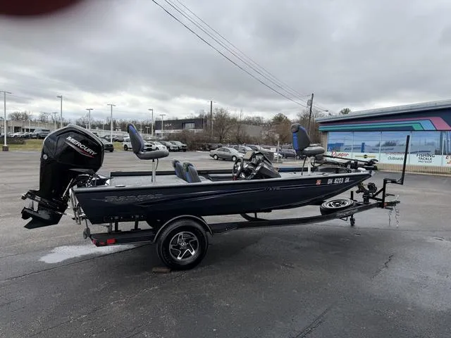 Slide: The Image of 2022 Ranger RT178 boat with trailer in a parking lot, featuring a Mercury outboard motor. - 4