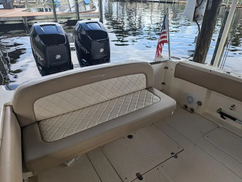 Slide: The Image of 2015 Chris-Craft Catalina 29 boat interior with seating and twin Mercury engines. - 10
