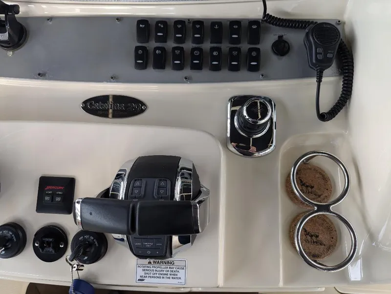 Slide: The Image of Control panel of 2015 Chris-Craft Catalina 29 boat with switches and throttle. - 13
